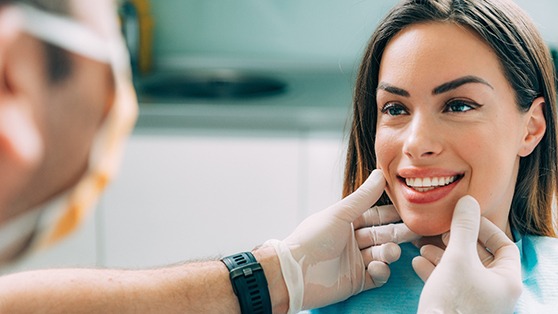 A dentist assessing his patient for cosmetic dentistry