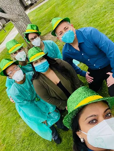 Sunnyvale Family and Cosmetic Dentistry staff posing together in matching hats