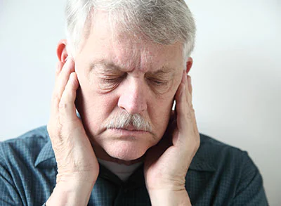 man experiencing TMJ pain